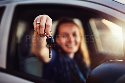 Buy stock photo Portrait of a young woman holding the keys to her new car