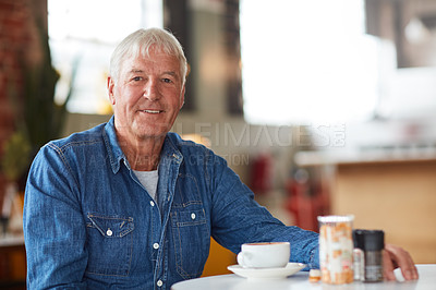 Buy stock photo Portrait of a relaxed senior man enjoying a cup of coffee in a coffee shop