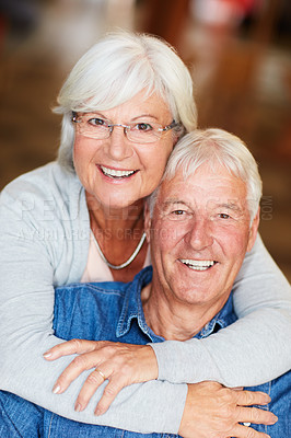 Buy stock photo Portrait of a happy senior couple bonding at the mall on the weekend