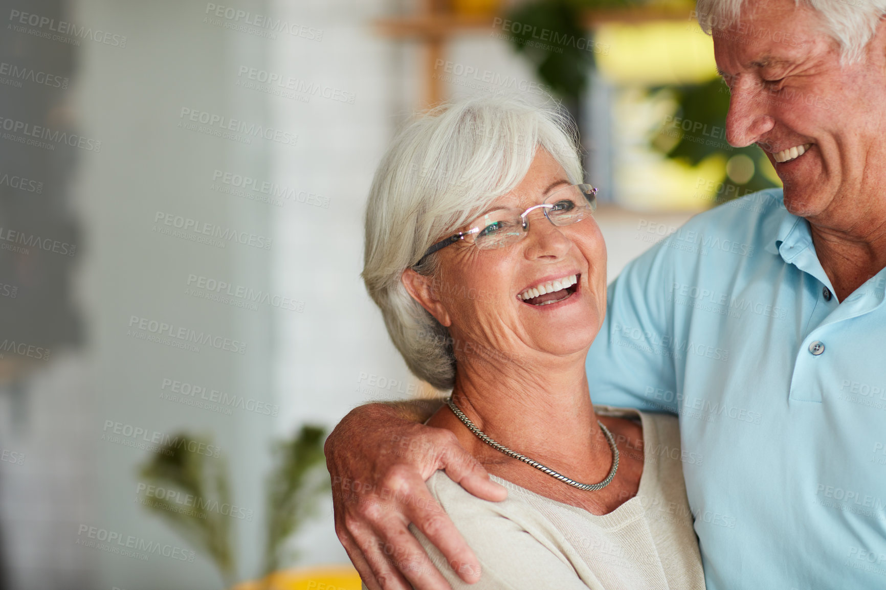 Buy stock photo Cropped shot of an affectionate senior couple in their local coffee shop