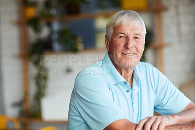 Buy stock photo Cropped portrait of a senior man sitting in his local coffee shop