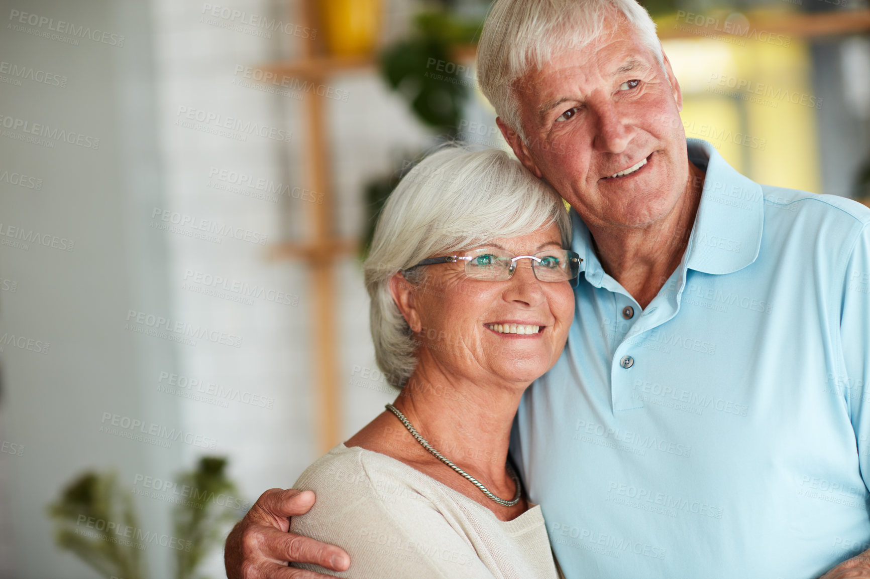 Buy stock photo Cropped shot of an affectionate senior couple in their local coffee shop