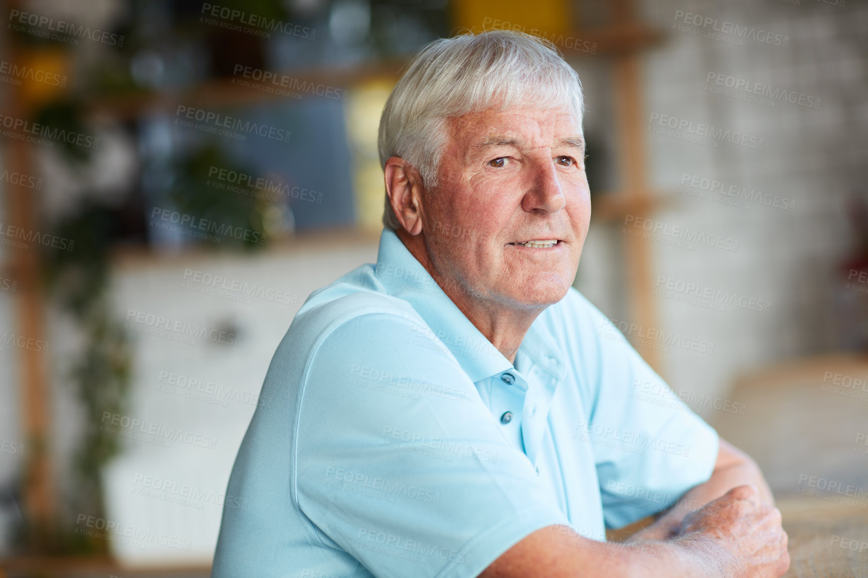 Buy stock photo Cropped shot of a senior man looking thoughtful while sitting in his local coffee shop