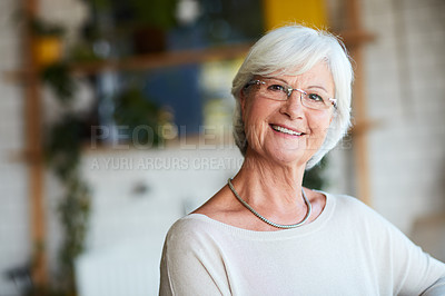 Buy stock photo Cropped portrait of a senior woman sitting in her local coffee shop