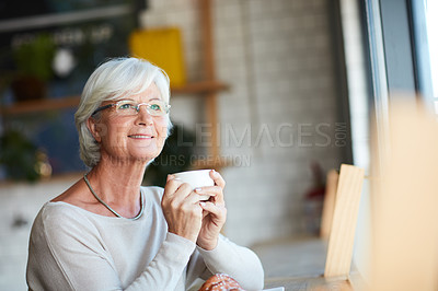 Buy stock photo Cropped shot of a senior man looking thoughtful while sitting in his local coffee shop