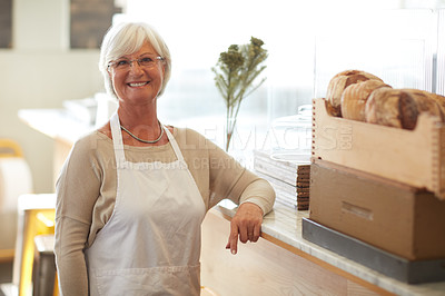 Buy stock photo Portrait of a happy senior woman working in a bakery