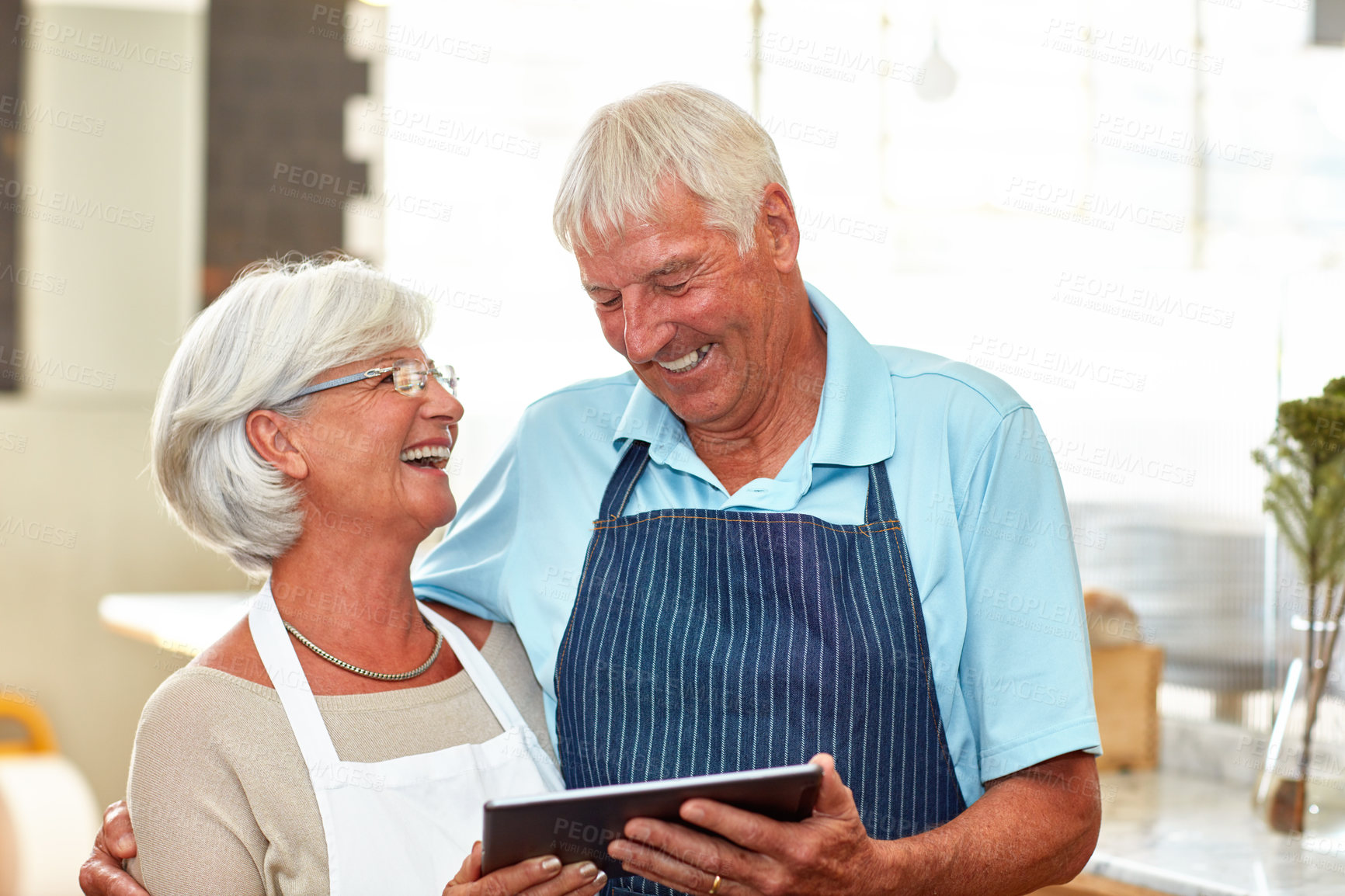 Buy stock photo Senior couple, tablet and business owner with laughing, internet and coffee shop with manager. Website, entrepreneur and elderly people with planning and proud from cafe and store with tech and staff