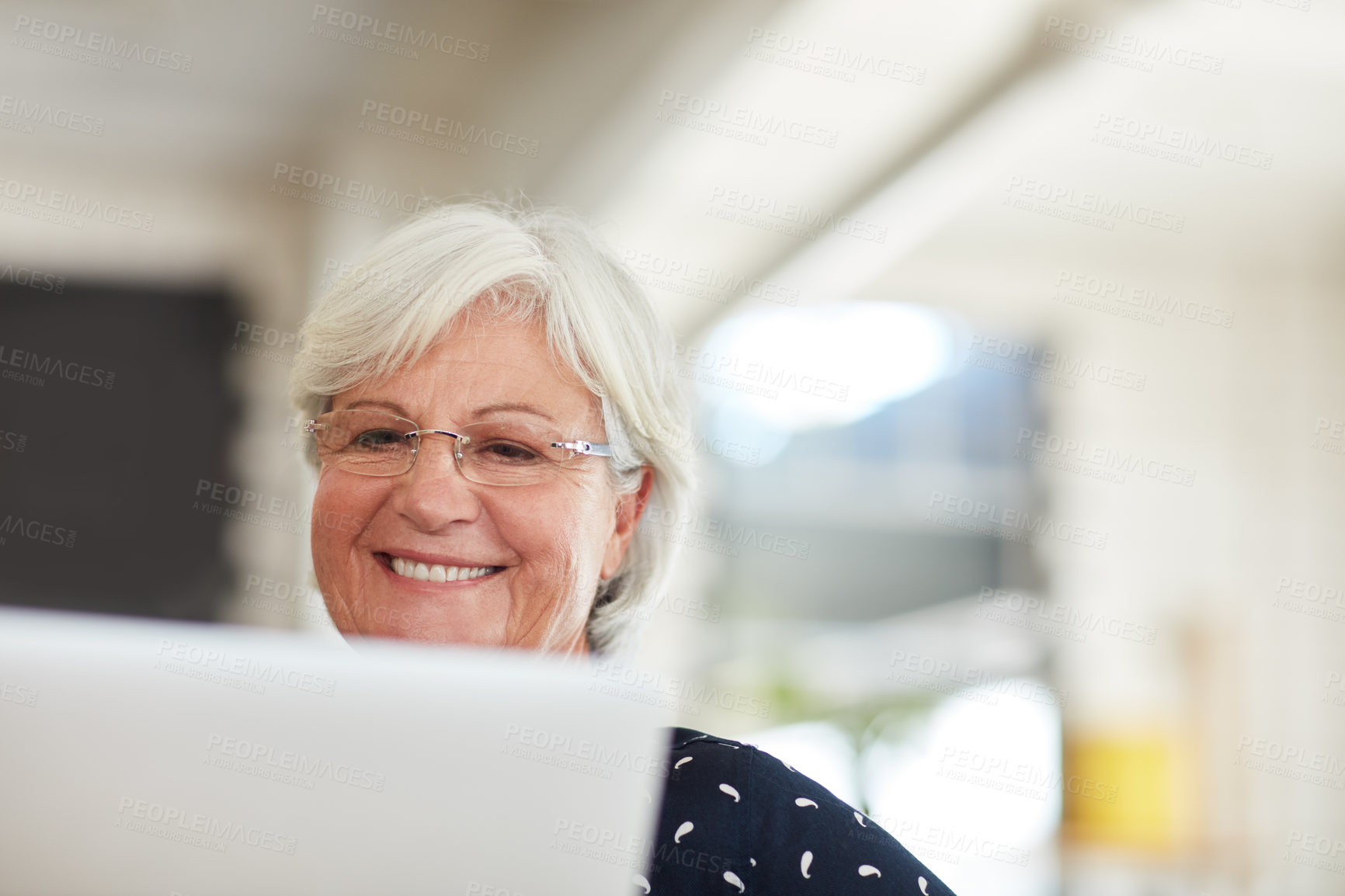Buy stock photo Cropped shot of a senior woman using her laptop