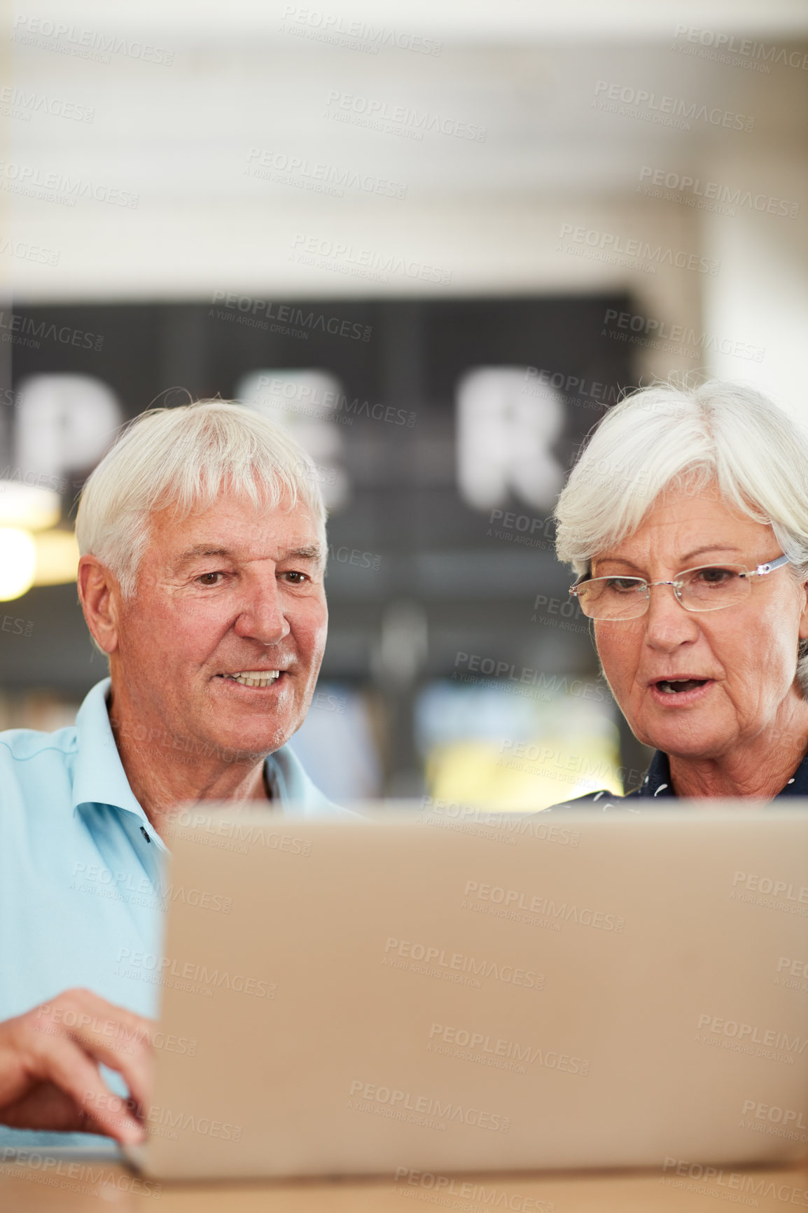 Buy stock photo Shot of a senior couple using a laptop together