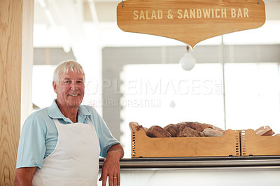 Buy stock photo Portrait of a happy senior man working in a bakery
