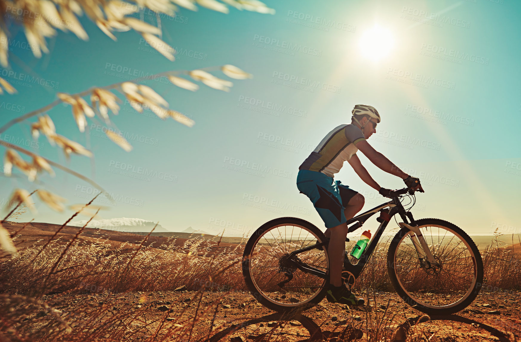 Buy stock photo Cropped shot of a man out cycling in the countryside