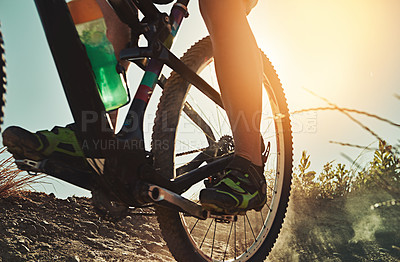 Buy stock photo Cropped shot of  an adventurous woman out cycling in the countryside