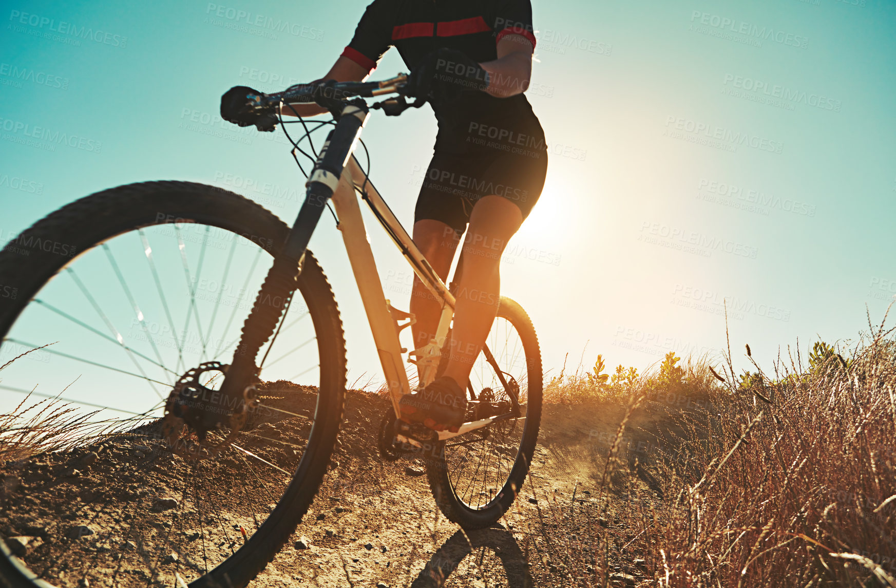 Buy stock photo Cropped shot of  an adventurous woman out cycling in the countryside