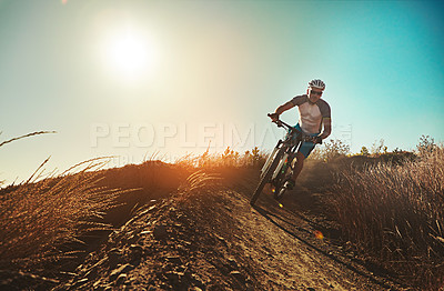 Buy stock photo Cropped shot of a man out cycling in the countryside