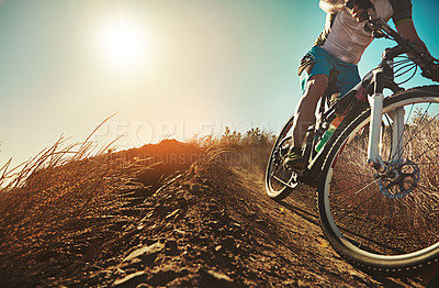 Buy stock photo Cropped shot of a man out cycling in the countryside