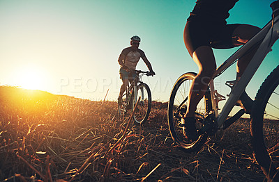 Buy stock photo Sunset sky, people and friends on bicycle with fitness, race and adventure trail in nature together. Cycling, exercise and team with mountain bike in evening for outdoor workout, sun and countryside