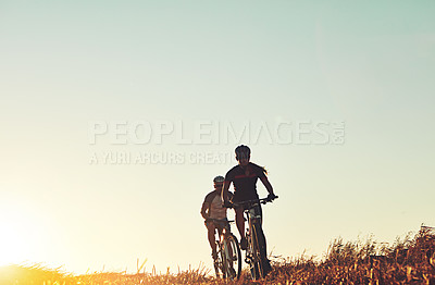 Buy stock photo Sunset sky, people and friends on bicycle with workout, race and adventure trail in nature together. Cycling, fitness and team with mountain bike in evening for outdoor exercise, sun and countryside