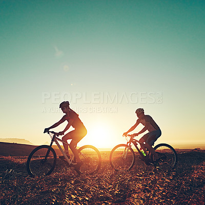 Buy stock photo Sunset sky, silhouette and people on bicycle with adventure, race and exercise in nature together. Cycling, fitness and friends with mountain bike in evening for outdoor workout, trail and grass path