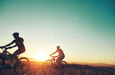 Buy stock photo Sunset, blue sky and people in bicycle race with adventure, trail and exercise in nature together. Cycling, fitness and friends with mountain bike in evening for outdoor workout, sport and grass path