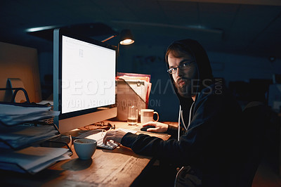 Buy stock photo Cropped portrait of a young computer programmer working late in the office