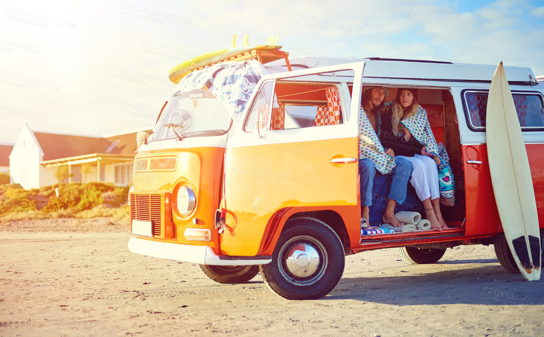 Buy stock photo Shot of an adventurous couple out roadtripping in their mini van