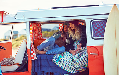 Buy stock photo Shot of an adventurous couple out roadtripping in their mini van