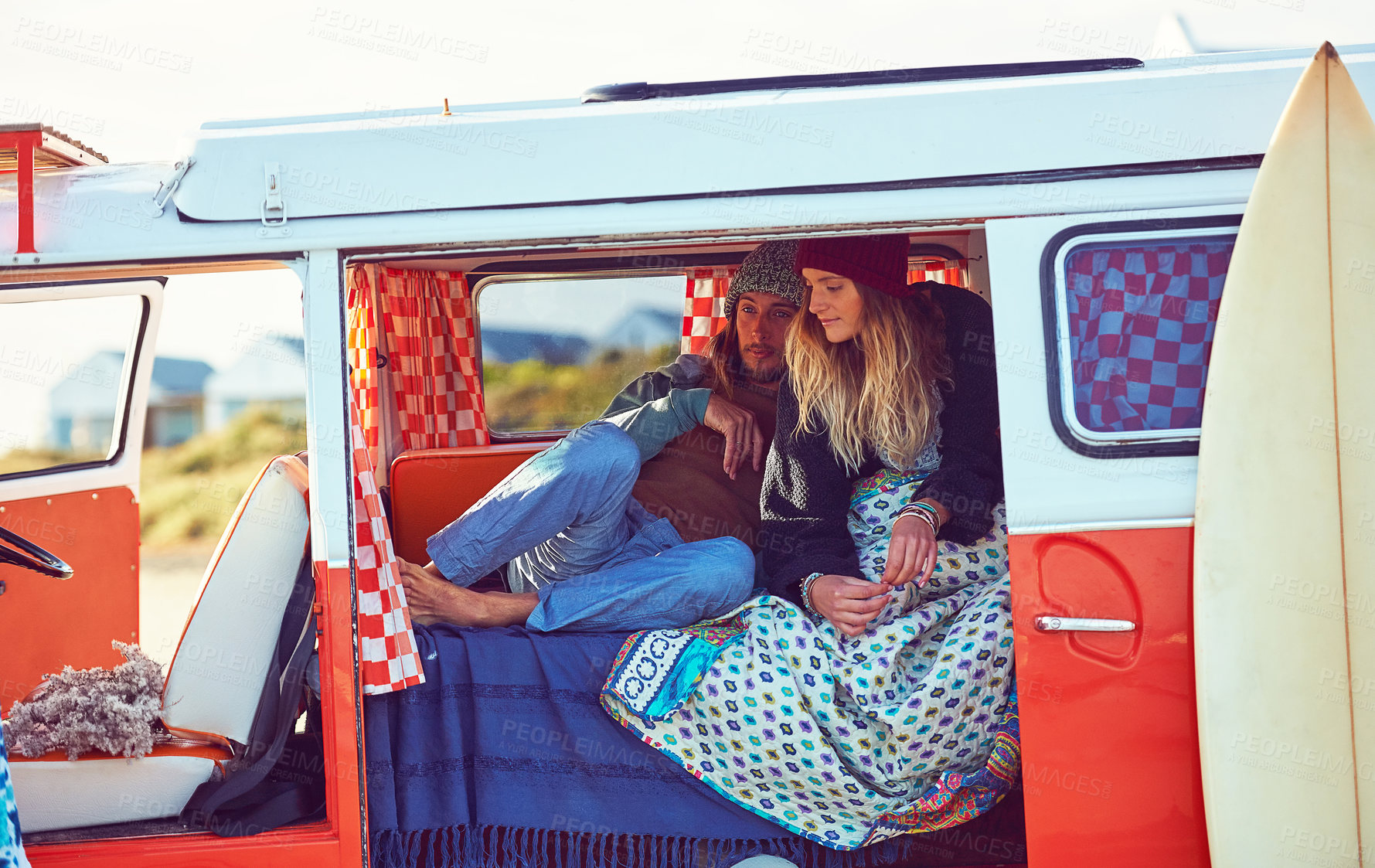 Buy stock photo Shot of an adventurous couple out roadtripping in their mini van