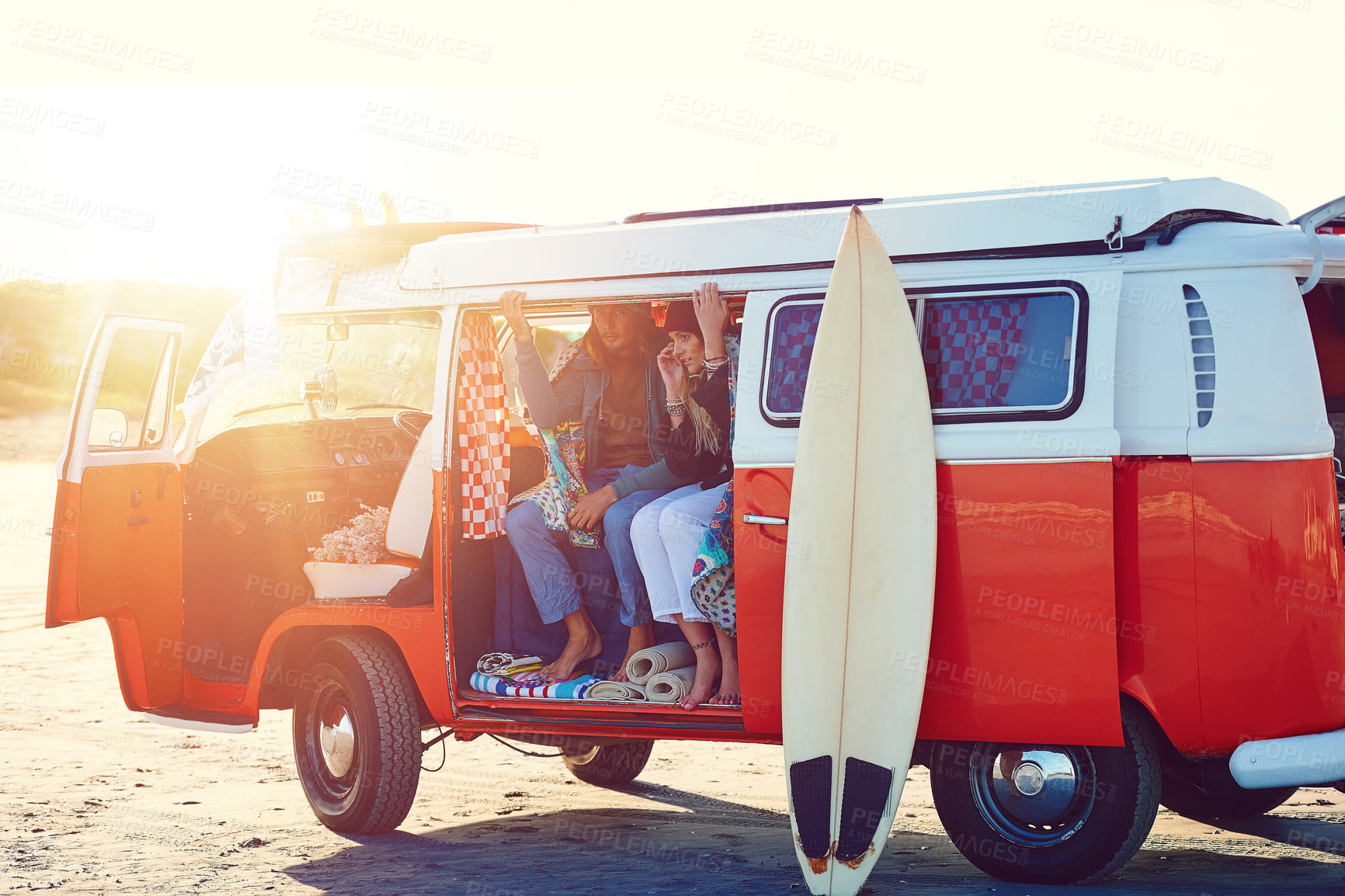 Buy stock photo Shot of an adventurous couple out roadtripping in their mini van