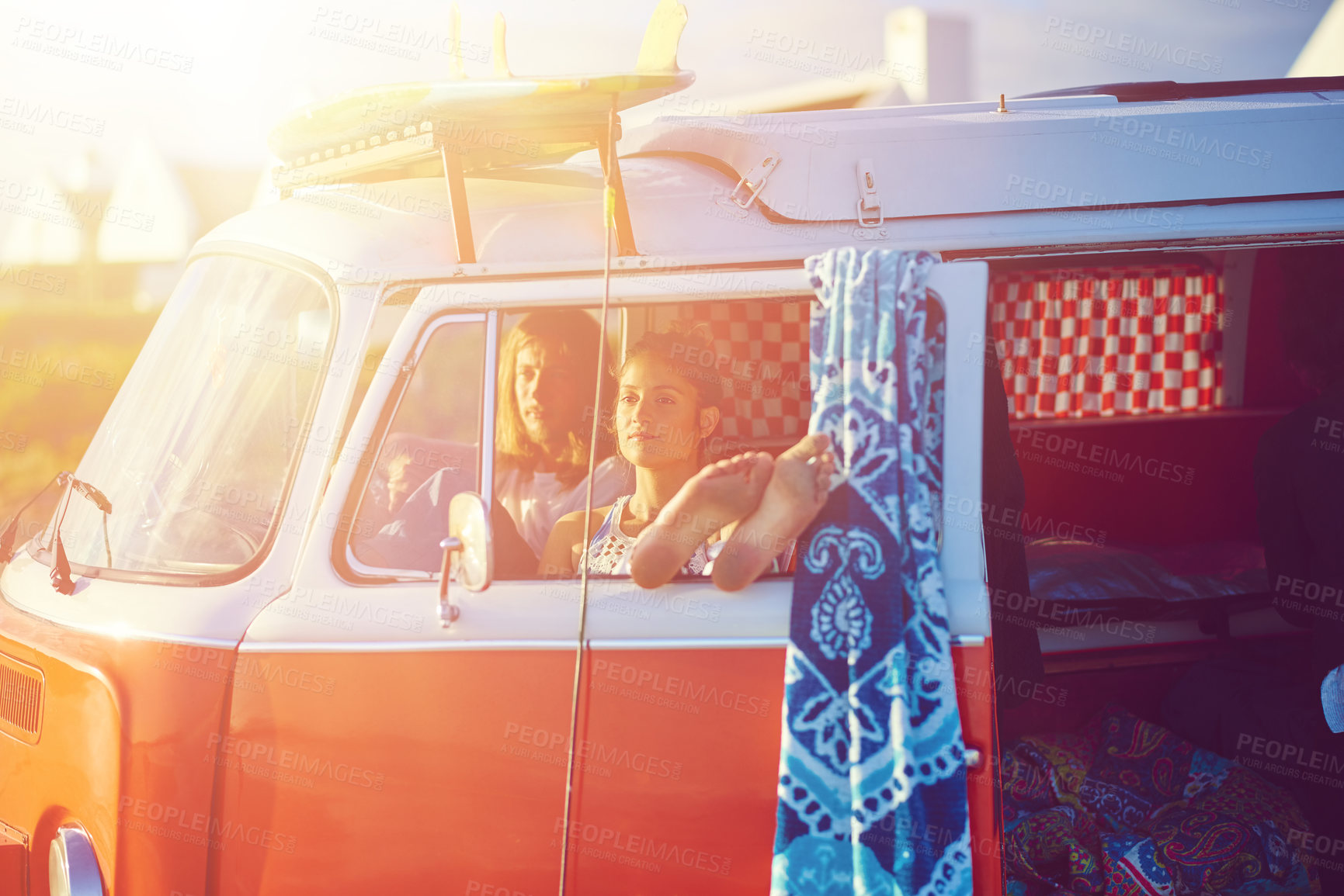 Buy stock photo Shot of an adventurous couple out roadtripping in their mini van