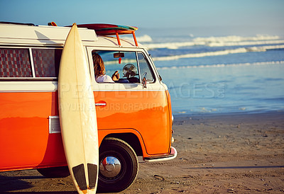 Buy stock photo Shot of a young man out roadtripping in his mini van