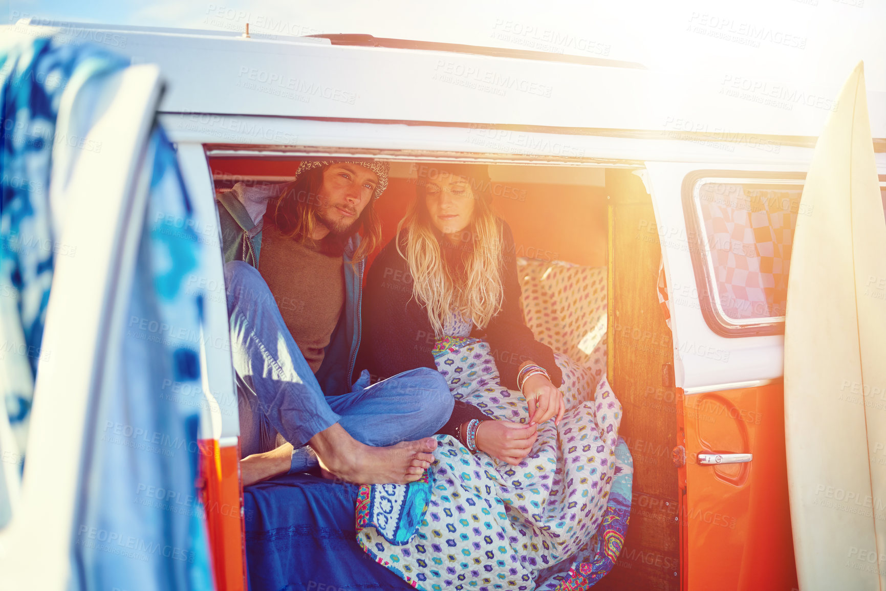 Buy stock photo Shot of an adventurous couple out roadtripping in their mini van