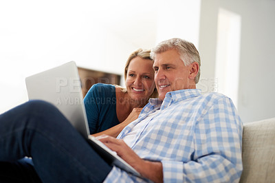 Buy stock photo Couple, couch and laptop with smile in home, streaming and relax in living room for movies. Internet, computer and love for website for video with married people, calm and lounge with technology pc