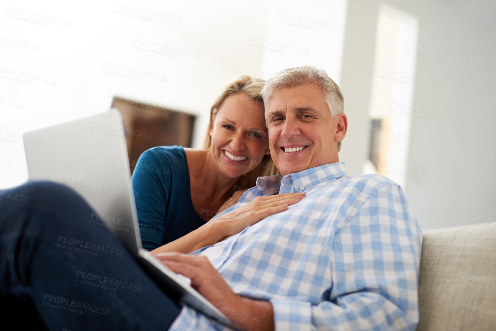 Buy stock photo Couple, couch and laptop with portrait in home, streaming and relax in living room for movies. Internet, computer or website for video and mature married people, smile and lounge with technology