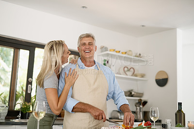 Buy stock photo Shot of a mature couple laughing in their home