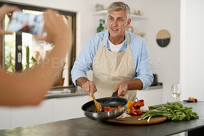 Buy stock photo Shot of a mature man cooking