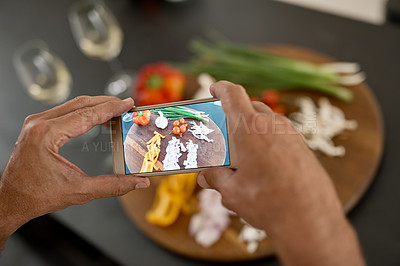 Buy stock photo Shot of a man taking a picture of ingredients with his phone