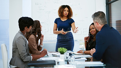 Buy stock photo Cropped shot of a young businesswoman giving a presentation in the boardroom