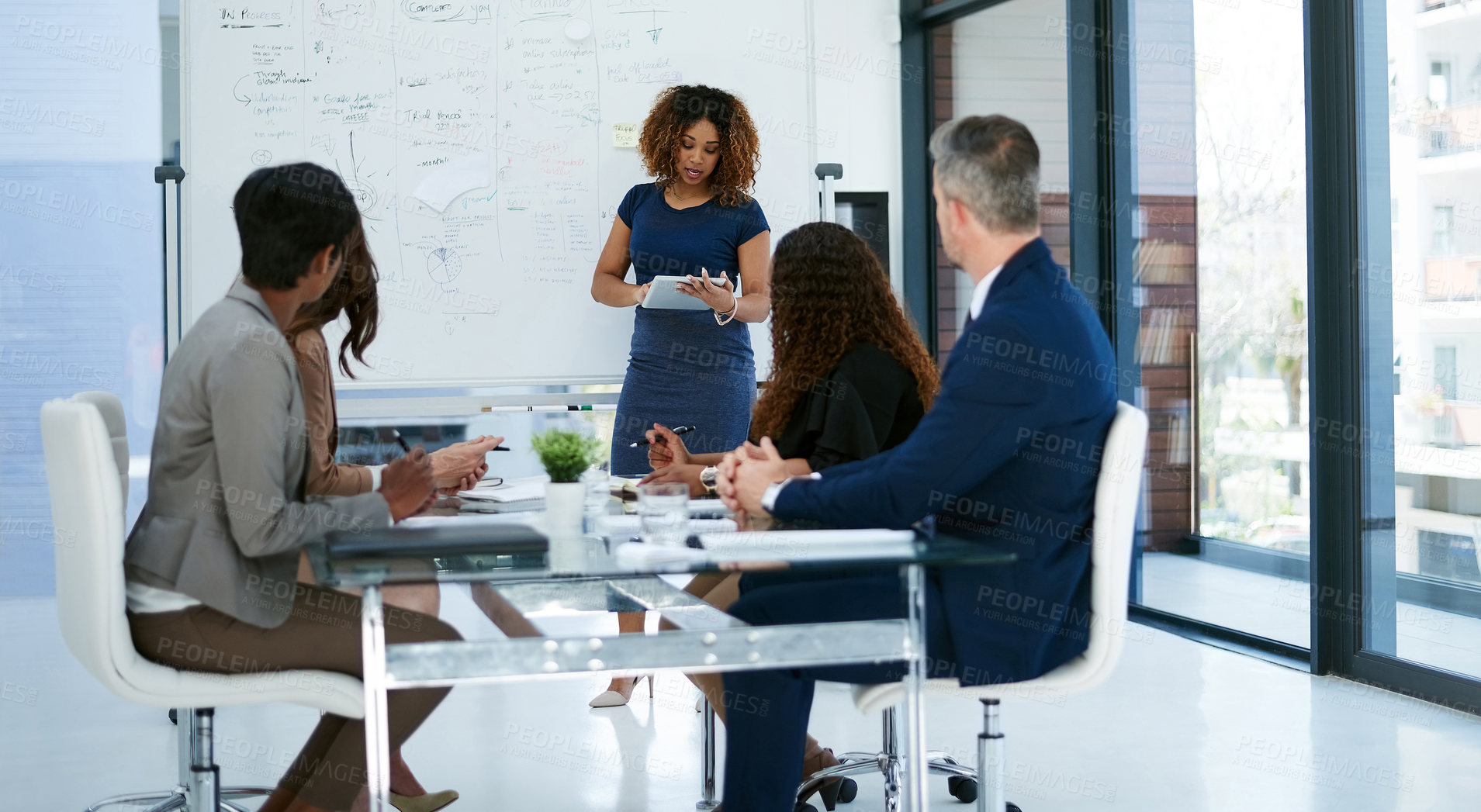 Buy stock photo Cropped shot of a young businesswoman giving a presentation in the boardroom