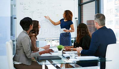 Buy stock photo Cropped shot of a young businesswoman giving a presentation in the boardroom
