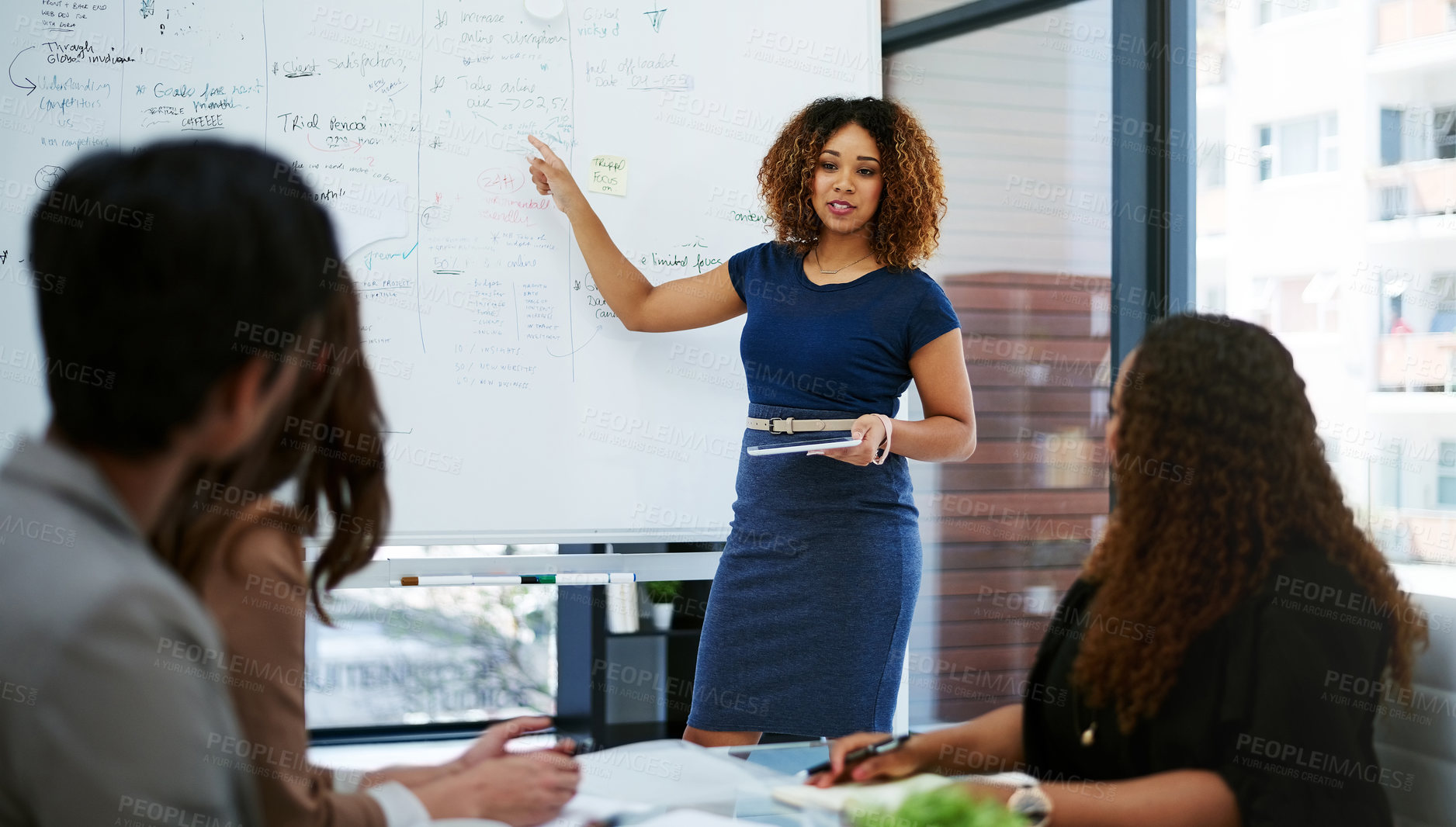 Buy stock photo Cropped shot of a young businesswoman giving a presentation in the boardroom