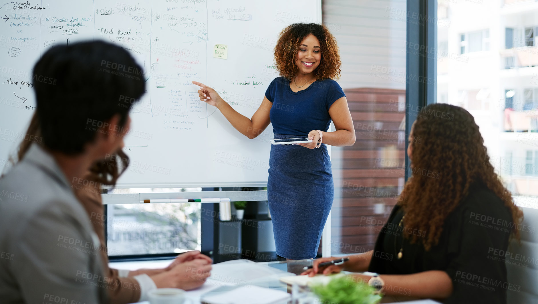 Buy stock photo Cropped shot of a young businesswoman giving a presentation in the boardroom