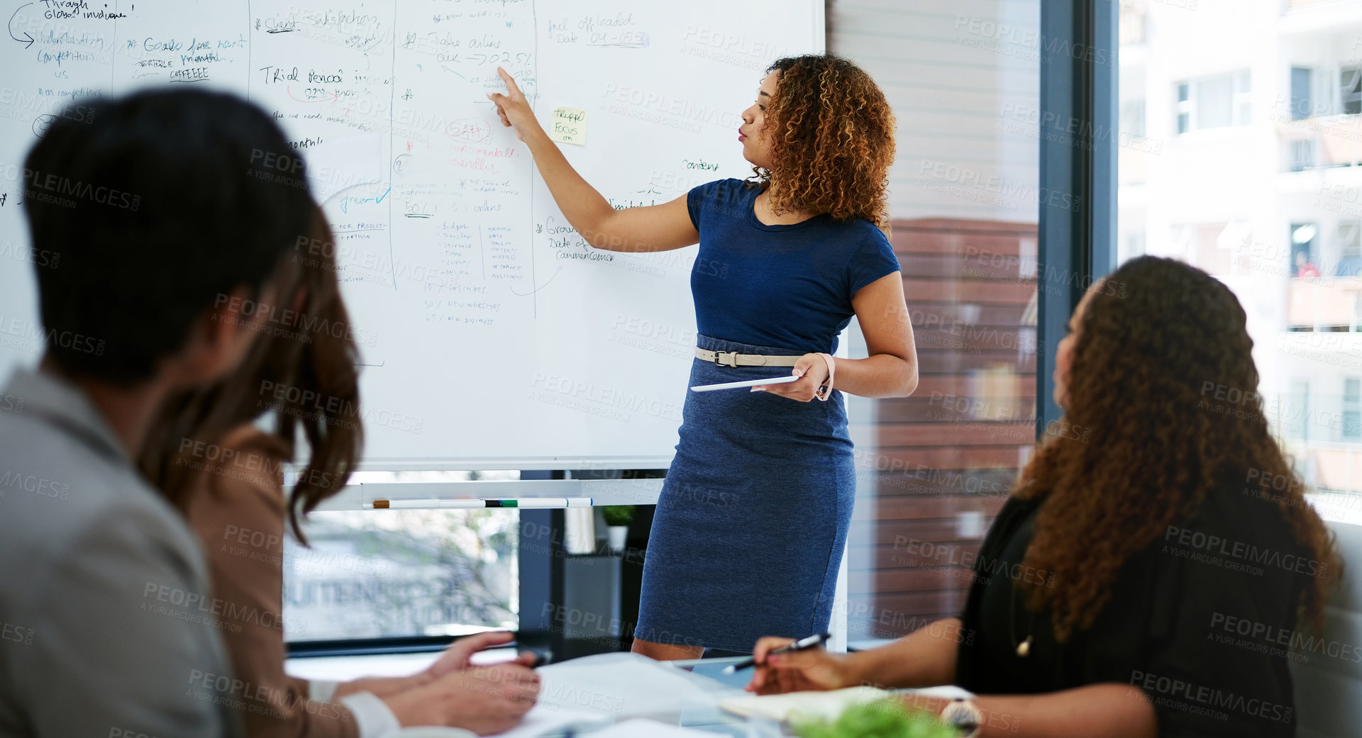 Buy stock photo Cropped shot of a young businesswoman giving a presentation in the boardroom