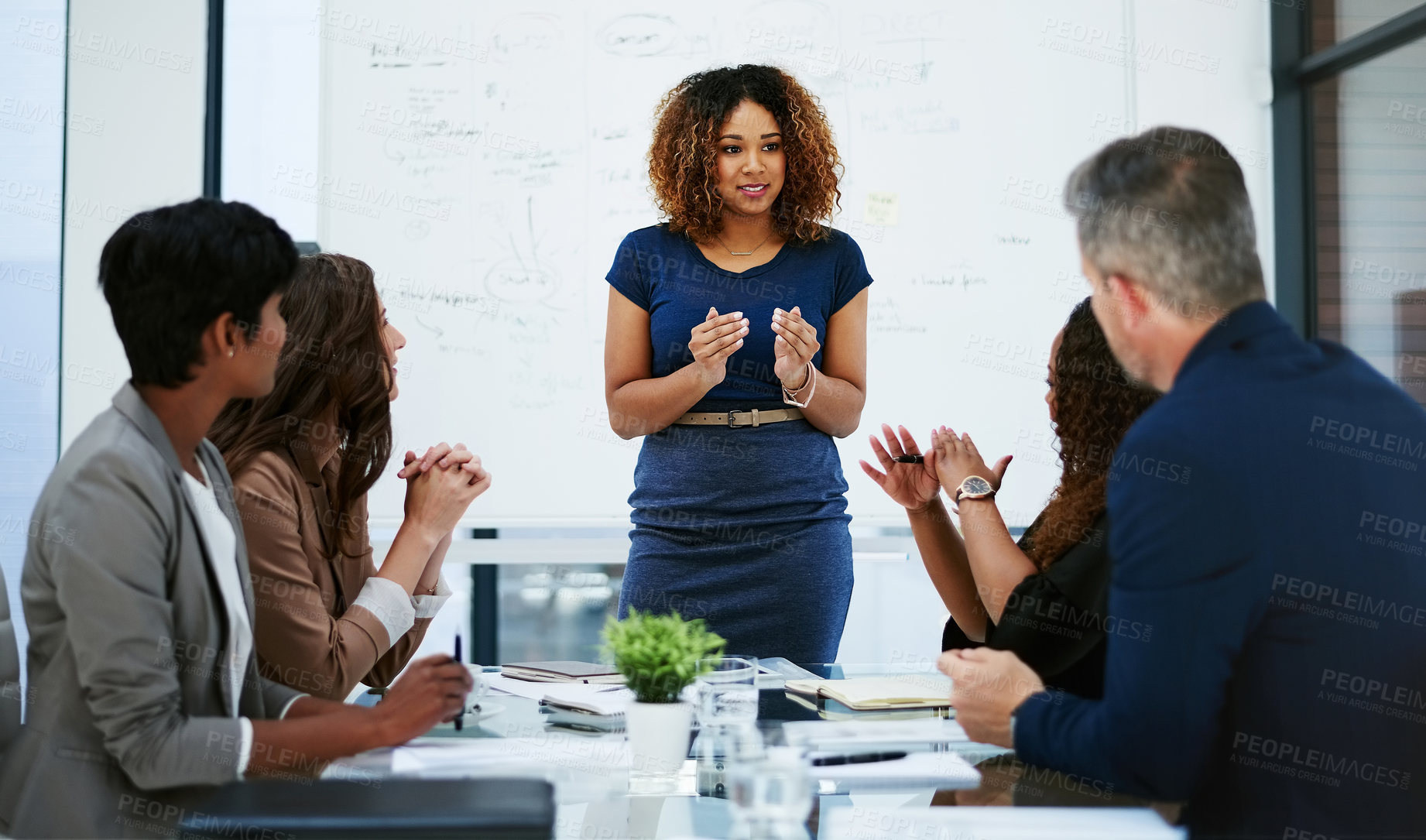 Buy stock photo Cropped shot of a young businesswoman giving a presentation in the boardroom