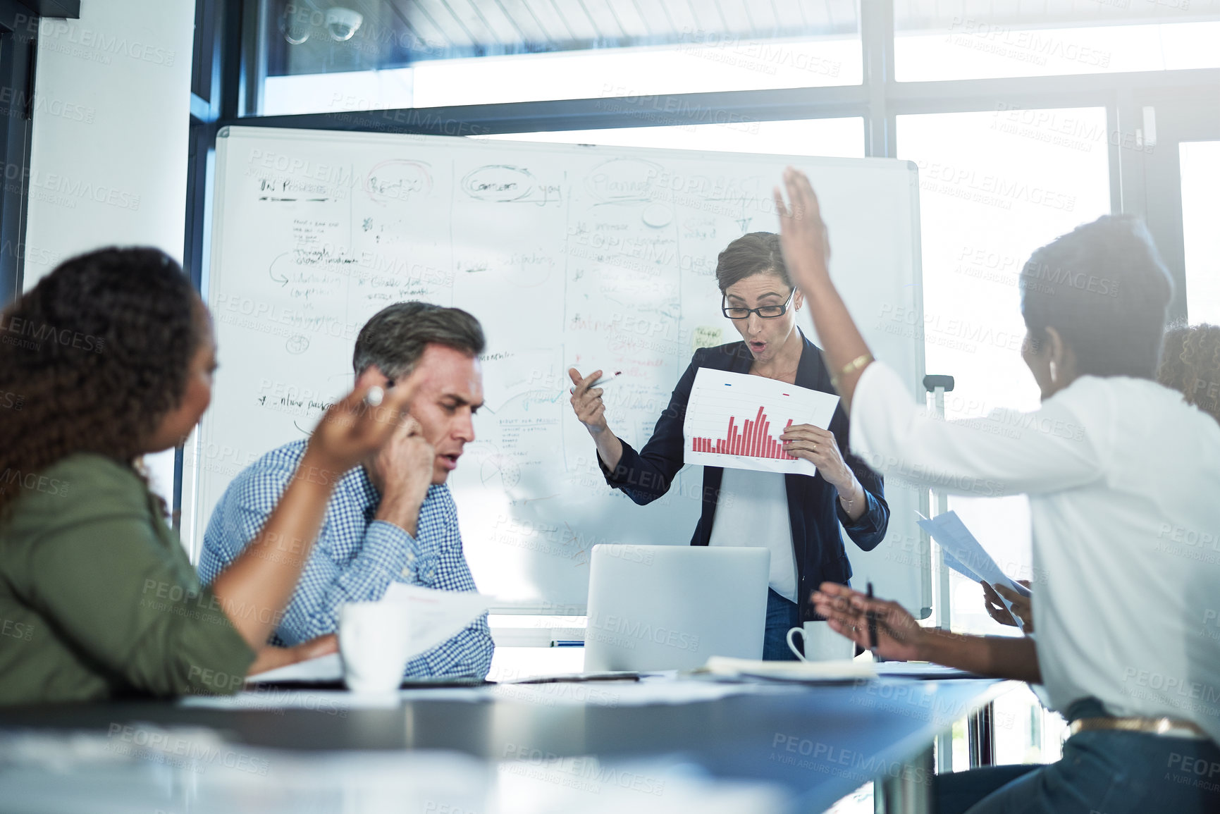 Buy stock photo Shot of a stressed businesswoman losing her temper during a meeting with her colleagues in the boardroom