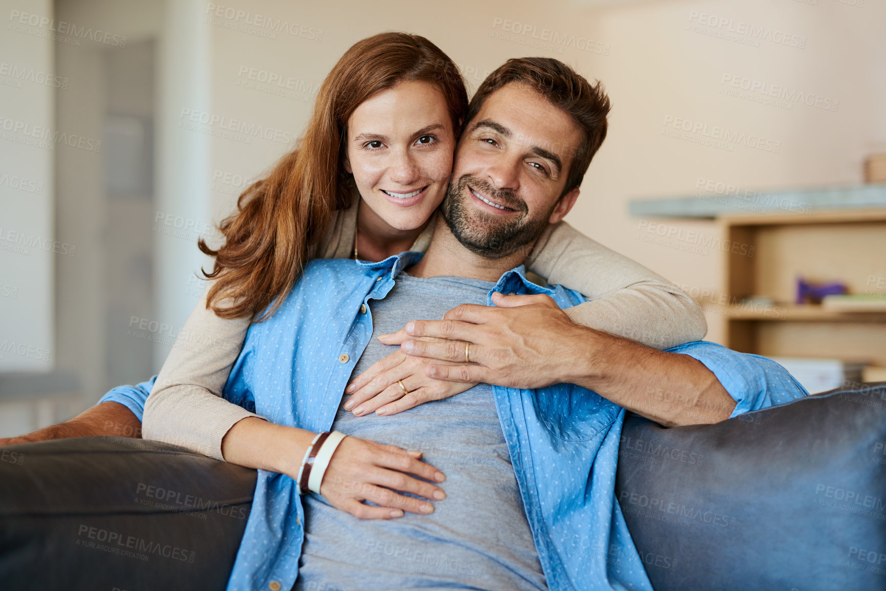 Buy stock photo Portrait, house and couple with love, hug and happiness with romance, smile and relationship. Face, apartment and man with woman, marriage or commitment with embrace, time together or relax in lounge