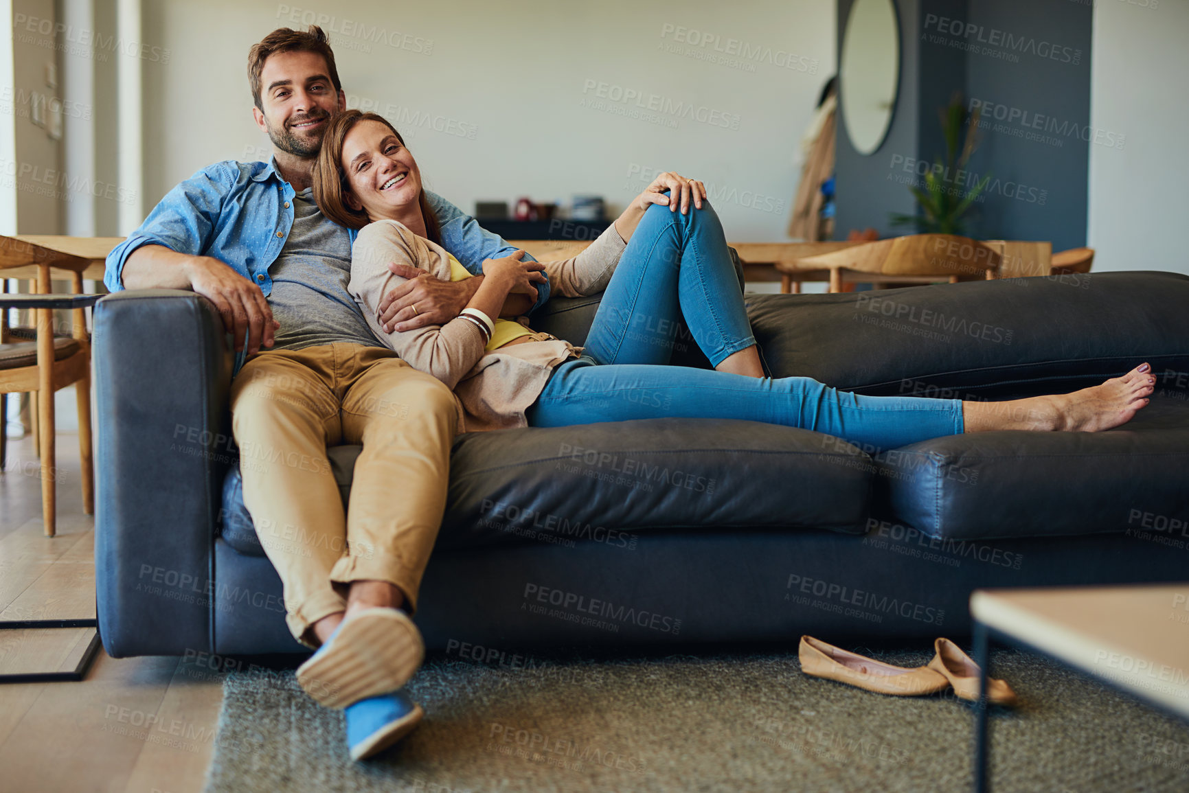 Buy stock photo Couple, portrait and relax in house with hug for relationship, comfort and bonding together with smile. Man, woman and embrace with happiness and love in living room for connection, care and break