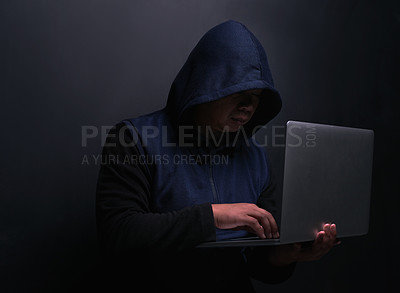 Buy stock photo Network, hacker and man with laptop in studio for cybersecurity, malware and scam on database. Cyber attack, crime and person with technology for fraud, coding risk and ransomware on black background