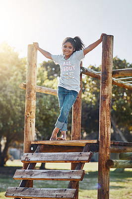 Buy stock photo Portrait of an adorable little girl playing at the park