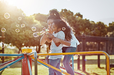 Buy stock photo Mother with daughter on roundabout at park, bubbles and playing together with fun outdoor. Love, care and bonding with family happiness, woman and girl enjoying time at playground with freedom