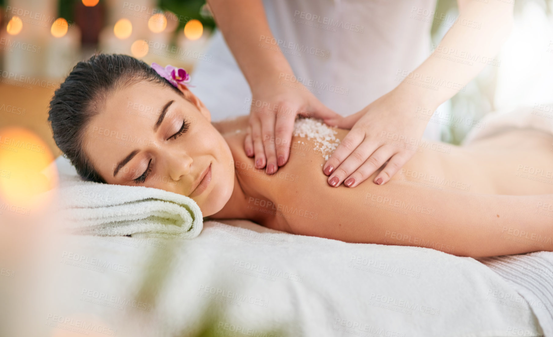 Buy stock photo Cropped shot of an attractive young woman getting an exfoliating treatment at the spa